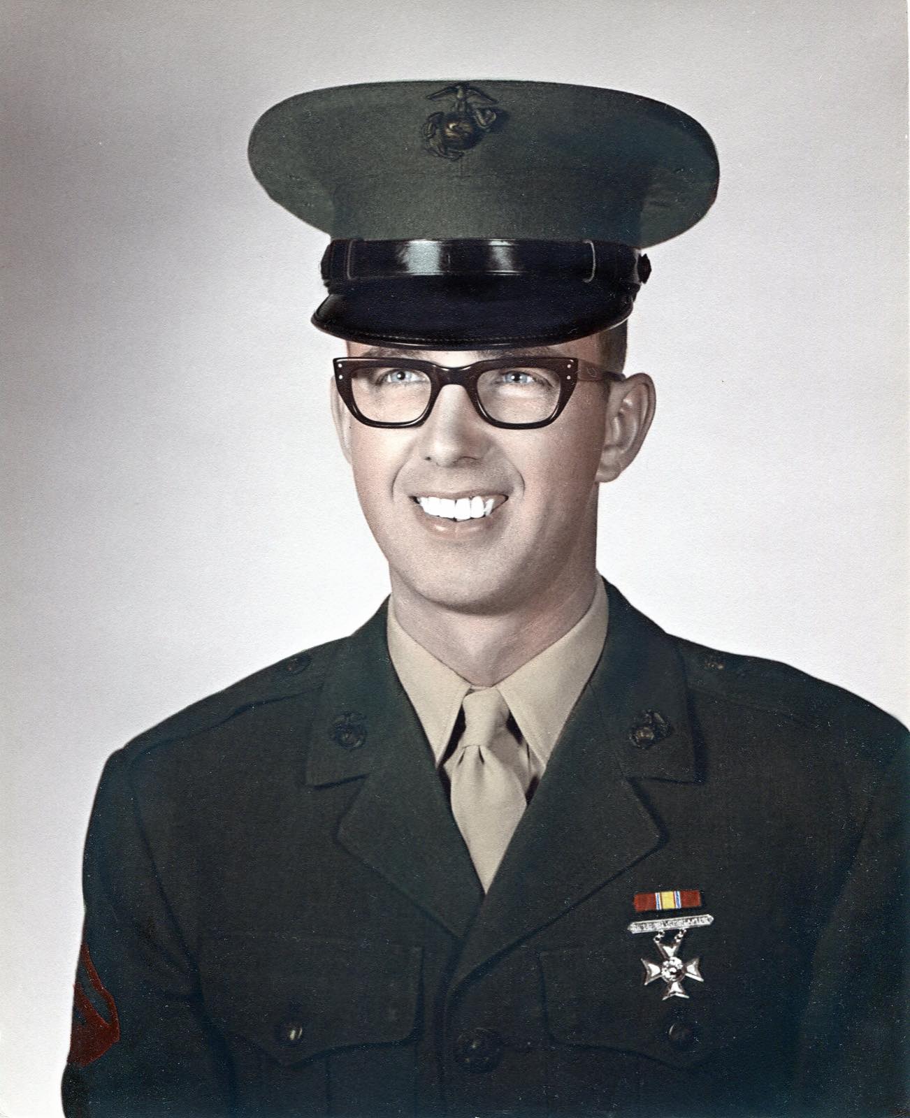 Studio portrait of Derl Horn in dress uniform, wearing his medal