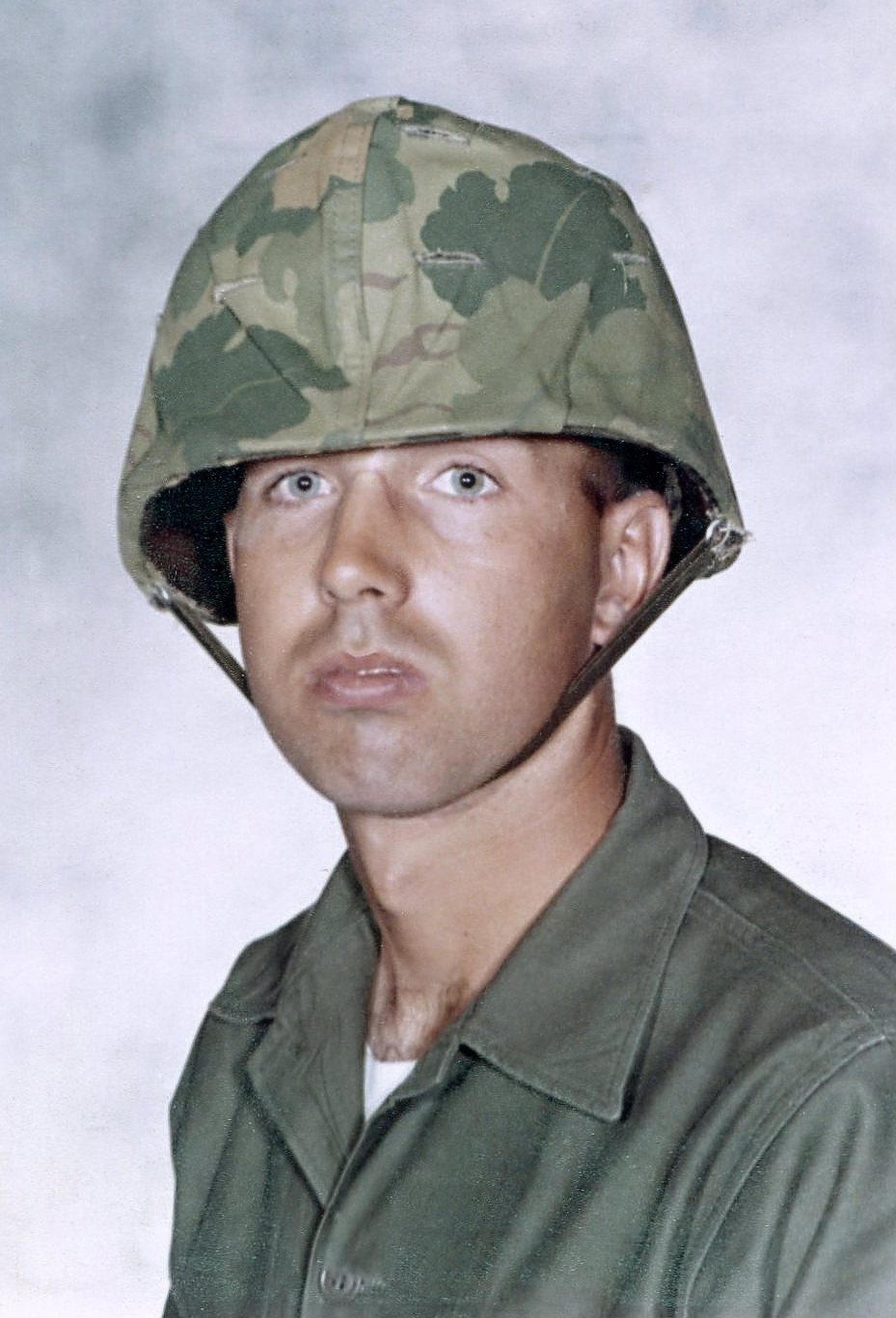 Derl Horn in Vietnam, wearing his camouflage-covered helmet