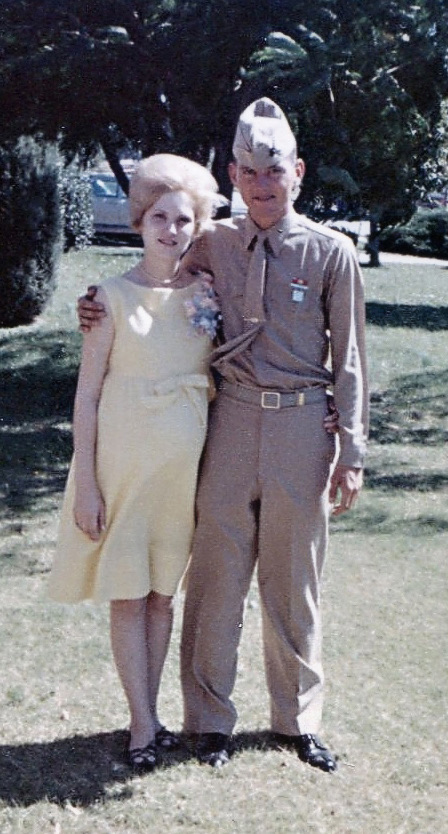 Derl, in uniform, with Marilyn outdoors