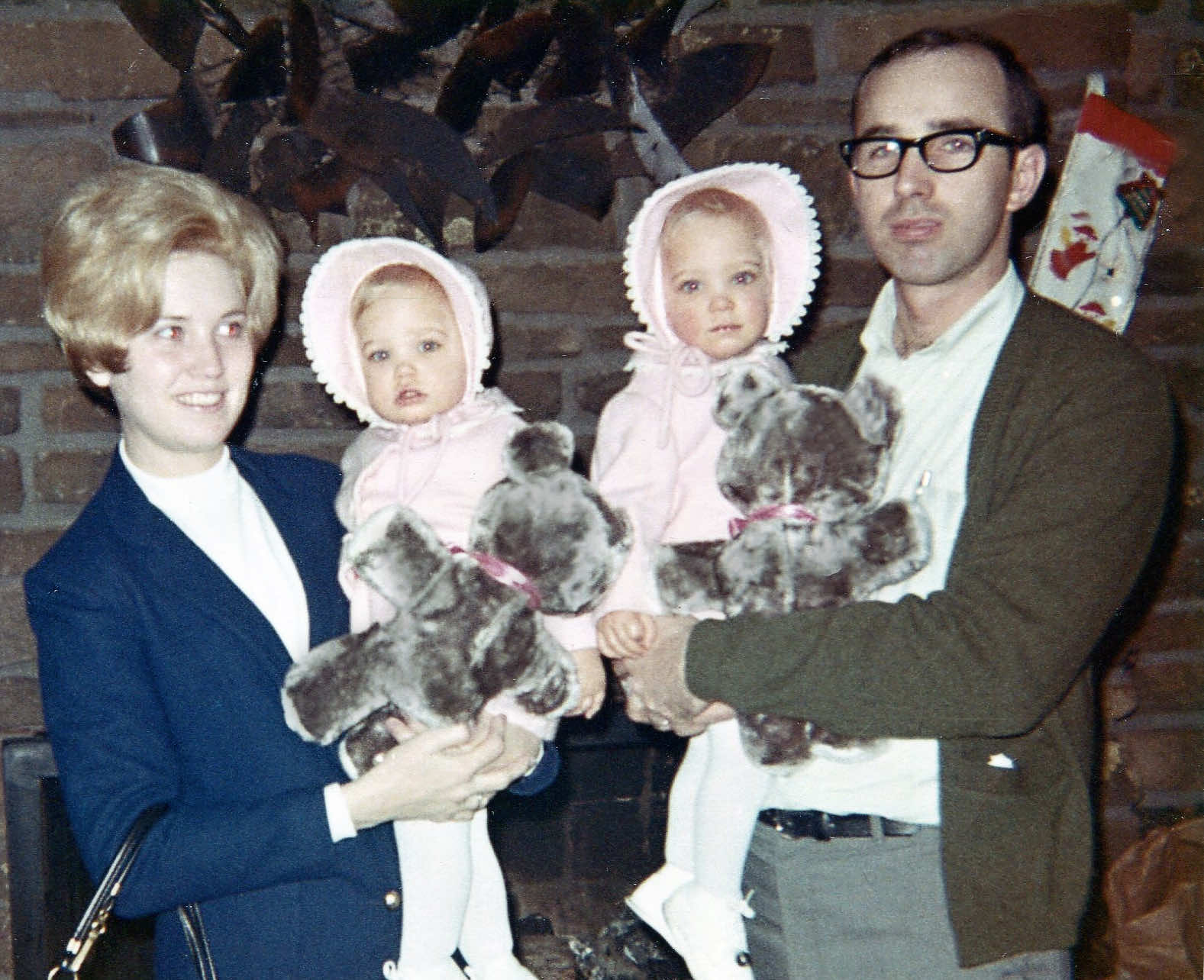 Derl and Marilyn with their twin daughters at Christmas